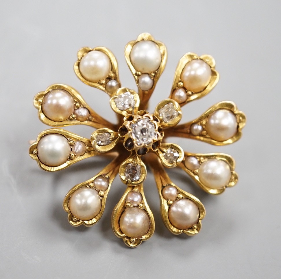 A Victorian yellow metal (tests as 15ct), diamond and split pearl set pendant brooch, 26mm, gross weight 6.9 grams.